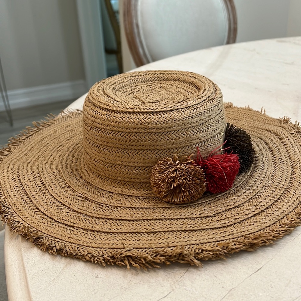 Straw bucket hat new with tags. Originally 59$